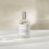 Room and linen spray bottle labeled &