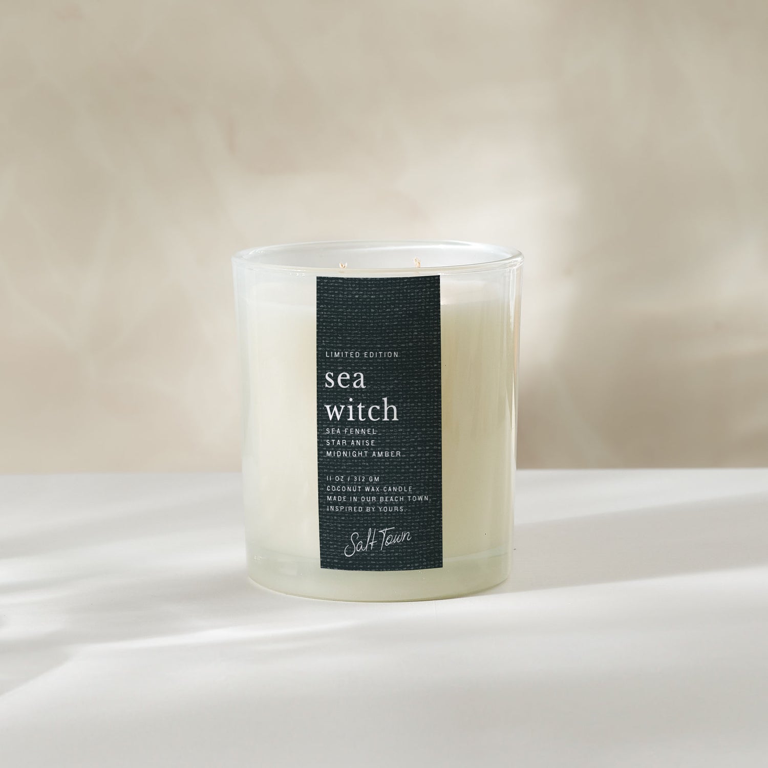 Candle labeled &