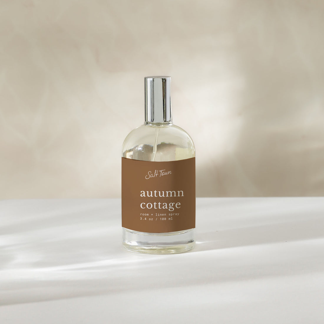 clear glass bottle with autumn cottage room spray label